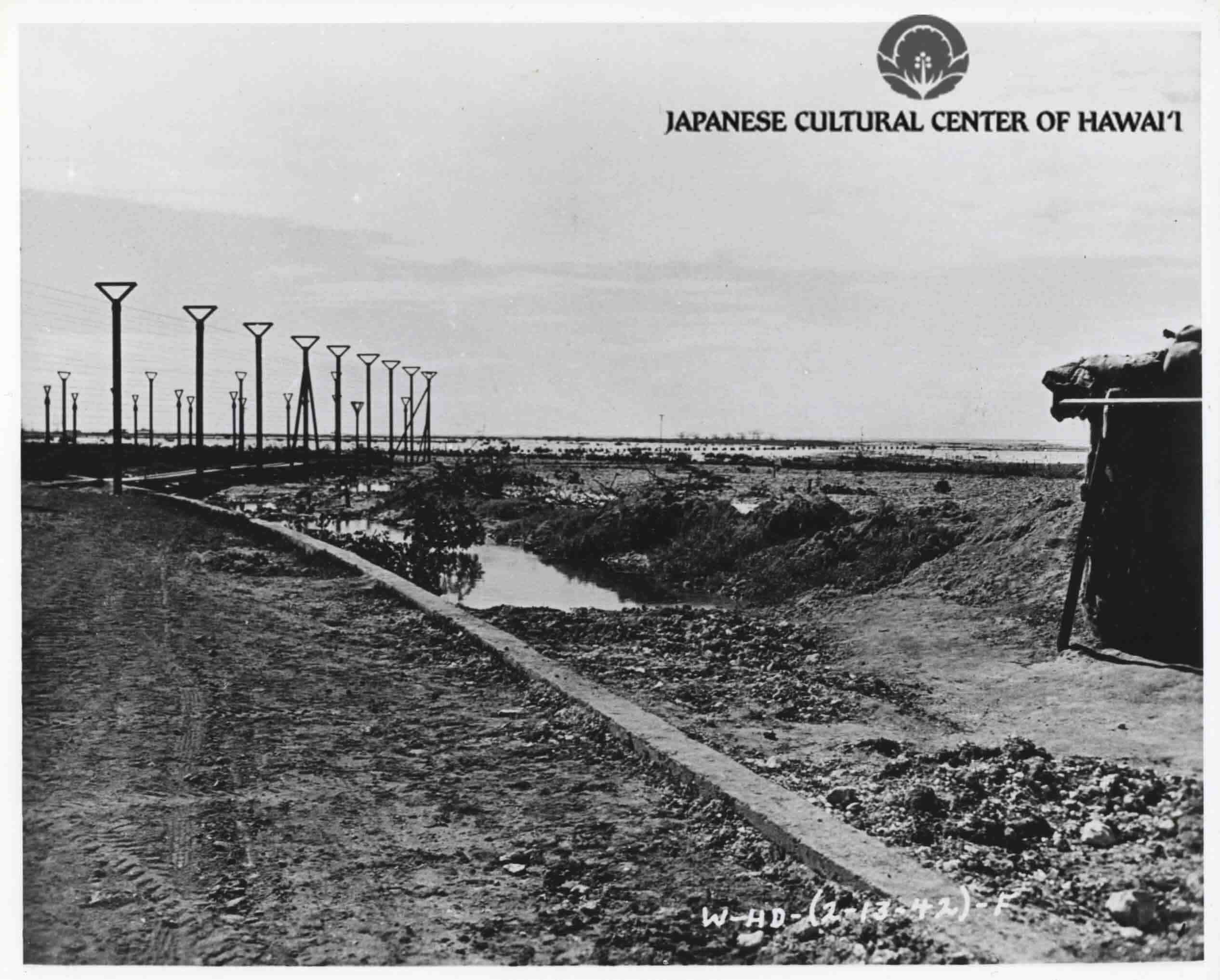Construction of Sand Island fence, 1942