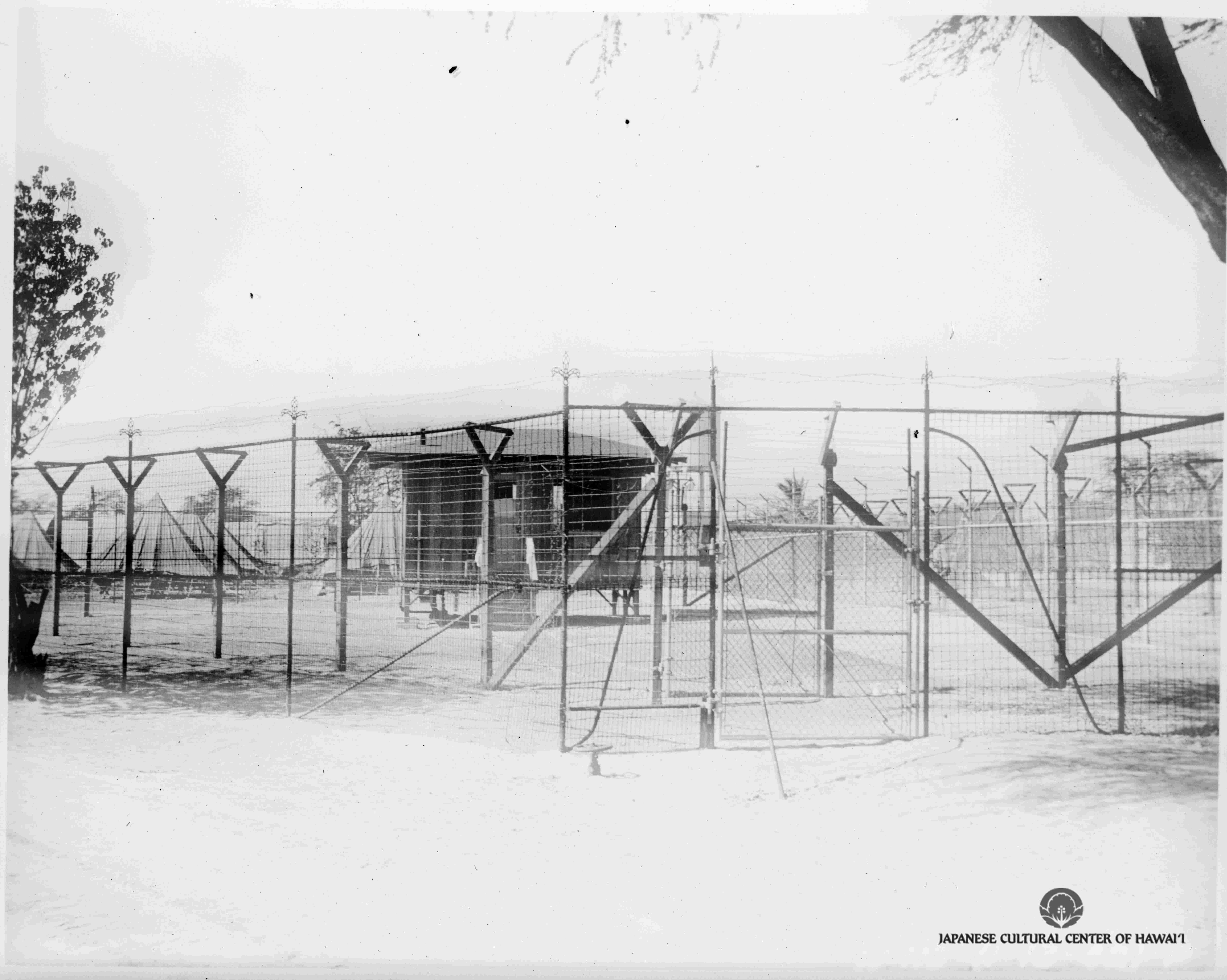 Sand Island fence in front of barracks